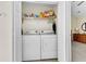 Laundry closet with a washer and dryer and storage at 303 Pine Bluff Dr, Summerville, SC 29483