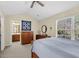 Inviting main bedroom featuring a large window with natural light, neutral decor, and ensuite bath at 303 Pine Bluff Dr, Summerville, SC 29483