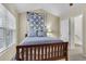 Comfortable bedroom featuring a queen bed, warm decor and bright window at 303 Pine Bluff Dr, Summerville, SC 29483