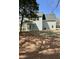 An inviting, screened-in porch extends to a well-maintained backyard, perfect for outdoor entertaining at 310 Woodland Shores Rd, Charleston, SC 29412