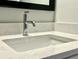 Close-up of a stylish bathroom sink with a sleek faucet and countertop, highlighting its contemporary design at 310 Woodland Shores Rd, Charleston, SC 29412