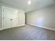 A lovely bedroom with plush carpeting and a closet with bi-fold doors at 310 Woodland Shores Rd, Charleston, SC 29412