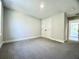 A bright bedroom features neutral paint, carpet, and a closet with double doors at 310 Woodland Shores Rd, Charleston, SC 29412