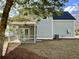 Back exterior view of home with screened porch and central air conditioning unit at 310 Woodland Shores Rd, Charleston, SC 29412