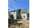 Back exterior of the home showing the screened in porch with the yard at 310 Woodland Shores Rd, Charleston, SC 29412