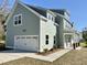 Lovely two-story home showing the garage, the covered porch, and the side entrance at 310 Woodland Shores Rd, Charleston, SC 29412