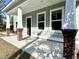 Welcoming front porch featuring classic columns with brick bases, leading to the home's entrance at 310 Woodland Shores Rd, Charleston, SC 29412