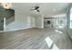 Expansive open-concept living room with a staircase, durable flooring, and natural light at 310 Woodland Shores Rd, Charleston, SC 29412