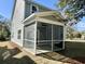 Exterior side view of the screened-in porch, a perfect place to relax at 310 Woodland Shores Rd, Charleston, SC 29412