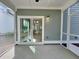 Screened-in porch with ceiling fan and sliding glass doors leading to the interior at 310 Woodland Shores Rd, Charleston, SC 29412
