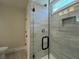 Modern shower with glass enclosure, rain shower head and built in niche at 310 Woodland Shores Rd, Charleston, SC 29412