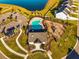 Aerial view of community pool, playground, lawn and parking area at 342 Saxony Loop, Summerville, SC 29486