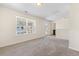 Bright bonus room with large window, neutral carpet, and access to the exterior at 342 Saxony Loop, Summerville, SC 29486