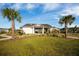 Community clubhouse with lush tropical landscaping and outdoor covered seating at 342 Saxony Loop, Summerville, SC 29486