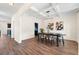 Elegant dining room with coffered ceilings, wood-look floors, and stylish light fixture with lots of natural light at 342 Saxony Loop, Summerville, SC 29486