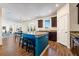 Open kitchen layout with an island featuring blue accents and barstool seating plus view to dining area at 342 Saxony Loop, Summerville, SC 29486