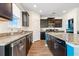 Modern kitchen features granite counters, stainless appliances and a beautiful wood-look flooring at 342 Saxony Loop, Summerville, SC 29486