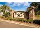 Entrance sign for Saxony Lake community, showcasing lush landscaping at 342 Saxony Loop, Summerville, SC 29486