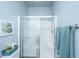 Modern bathroom features a tiled shower with glass door, white subway tile, and bench seat at 401 Forsythia Ave, Summerville, SC 29483