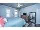 Spacious bedroom featuring a queen-sized bed, ample natural light, and a dresser, creating a relaxing environment at 401 Forsythia Ave, Summerville, SC 29483