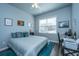 Cozy bedroom with a comfortable bed, accent pillows, and bright natural light at 401 Forsythia Ave, Summerville, SC 29483