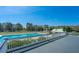 This community pool offers a relaxing place to cool off, with lots of seating and trees nearby at 401 Forsythia Ave, Summerville, SC 29483