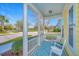 Inviting covered front porch with rocking chairs and a stylish patterned rug at 401 Forsythia Ave, Summerville, SC 29483