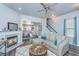 Comfortable living room with a fireplace, plush seating, and seamless flow to dining area at 401 Forsythia Ave, Summerville, SC 29483