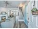 Bright, open-concept living room with fireplace, hardwood floors, and access to the staircase at 401 Forsythia Ave, Summerville, SC 29483