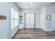 Bright sitting room featuring large windows, stylish curtains, and a cozy atmosphere, creating a welcoming space at 401 Forsythia Ave, Summerville, SC 29483