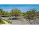 A peaceful street view with green trees and a serene pond in the distance at 401 Forsythia Ave, Summerville, SC 29483