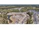 Aerial shot of ponds with fountains, landscaping, and street-lined houses within a community at 4075 Aspera Dr, Summerville, SC 29483