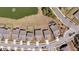 An aerial view of a residential community with houses, streets, and a pond with a fountain at 4075 Aspera Dr, Summerville, SC 29483