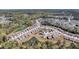 Expansive aerial view of a community with serene ponds, tree-lined streets, and carefully designed landscaping at 4075 Aspera Dr, Summerville, SC 29483