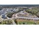 An expansive view of a Primary-planned community, showcasing winding roads, pristine ponds, and mature trees at 4075 Aspera Dr, Summerville, SC 29483