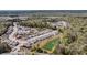 An aerial view highlighting the meticulous community layout with lush ponds, landscaping, and tree-lined streets at 4075 Aspera Dr, Summerville, SC 29483