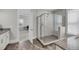 Modern bathroom featuring walk-in shower with marble surround and an ensuite bathroom with access to a bedroom at 4075 Aspera Dr, Summerville, SC 29483