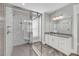 Modern bathroom featuring walk-in shower with marble surround, vanity, and a large window for natural light at 4075 Aspera Dr, Summerville, SC 29483