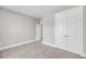 Neutral bedroom with carpet, white trim, and a closet with double doors at 4075 Aspera Dr, Summerville, SC 29483