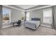 Bright bedroom featuring a work desk, a comfortable bed, and lots of natural light from the multiple windows at 4075 Aspera Dr, Summerville, SC 29483