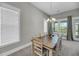 Cozy dining room with a classic table and chairs set by a window with natural light at 4075 Aspera Dr, Summerville, SC 29483