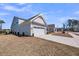 Charming home with a two-car garage and light gray siding, set against a bright blue sky at 4075 Aspera Dr, Summerville, SC 29483