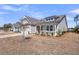Beautiful home with light gray siding, a welcoming front porch, and a two-car garage at 4075 Aspera Dr, Summerville, SC 29483