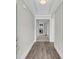 Bright foyer featuring wood floors, white trim, and an open doorway to the living spaces at 4075 Aspera Dr, Summerville, SC 29483