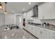 Bright kitchen featuring granite countertops, stainless steel appliances, and sleek white cabinets at 4075 Aspera Dr, Summerville, SC 29483