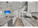 Modern kitchen with a large island, granite countertops, stainless steel appliances, and stylish pendant lighting at 4075 Aspera Dr, Summerville, SC 29483
