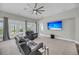 Bright living room with plush seating, a ceiling fan, and access to the outdoor deck area at 4075 Aspera Dr, Summerville, SC 29483