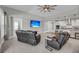 Comfortable living room with a large flat-screen television and two reclining chairs for relaxation at 4075 Aspera Dr, Summerville, SC 29483