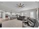 Open-concept living area with recliners, a dining area, and a bright modern kitchen with bar stool seating at 4075 Aspera Dr, Summerville, SC 29483