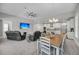 Open-concept living space featuring recliners, a dining area, and a modern kitchen with stainless steel appliances at 4075 Aspera Dr, Summerville, SC 29483